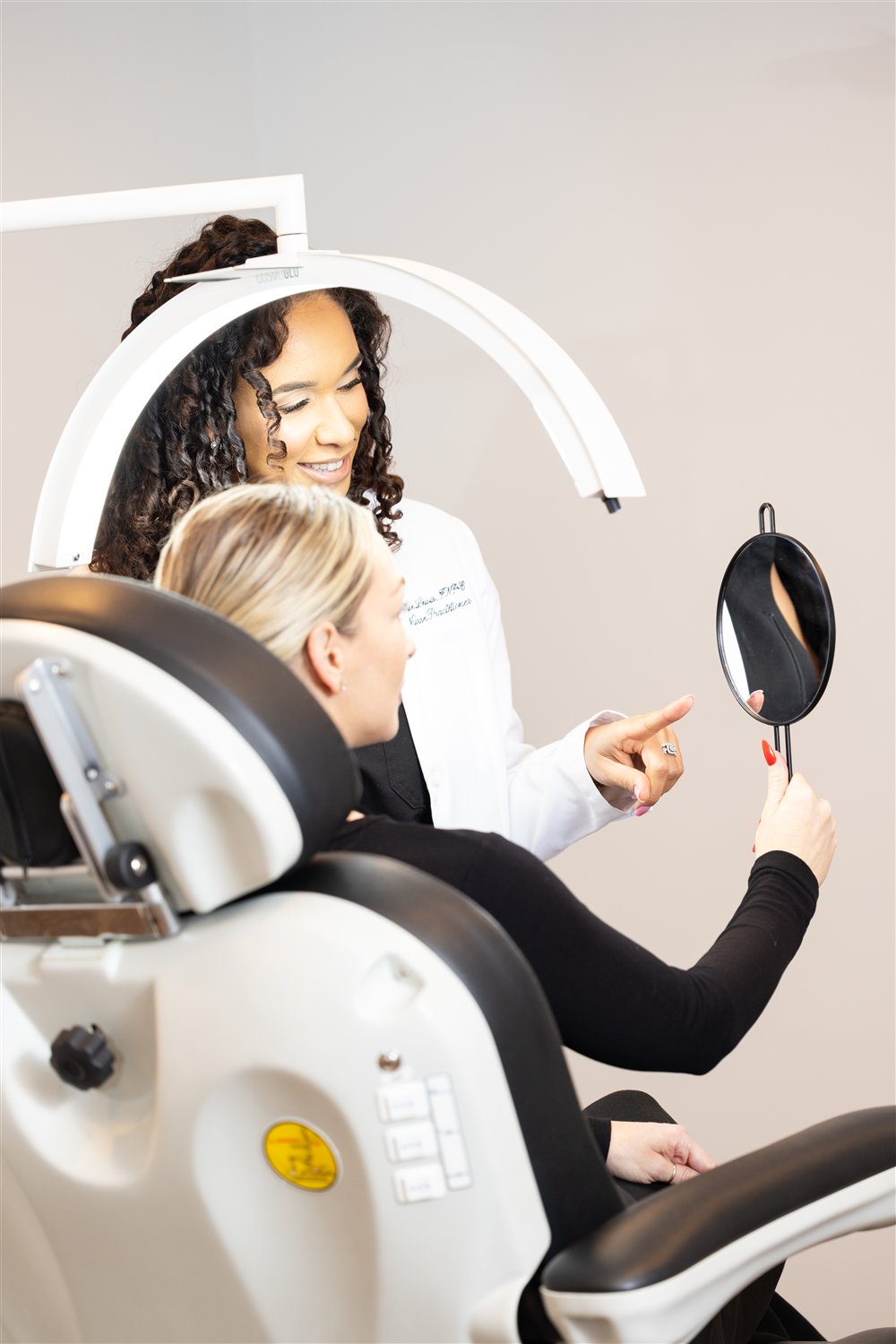 Cassie Lewis, NP consulting with a patient in the ZK Aesthetics treatment room, Sacramento